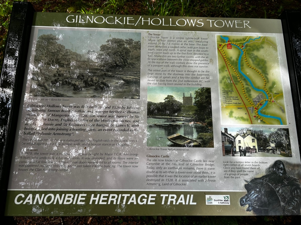 Informational sign detailing the history of Gilnockie/Hollows Tower. The sign includes a description of the tower's architecture, a brief history of its construction and destruction (and subsequent restoration), and its association with the infamous Johnnie Armstrong. Several photographs are included, showing the tower before and after renovation, as well as a depiction of Johnnie Armstrong and a map of the surrounding area. The text highlights the tower's significance within the Canonbie Heritage Trail and encourages a small puzzle, requiring visitors to find hidden letters across multiple boards. 